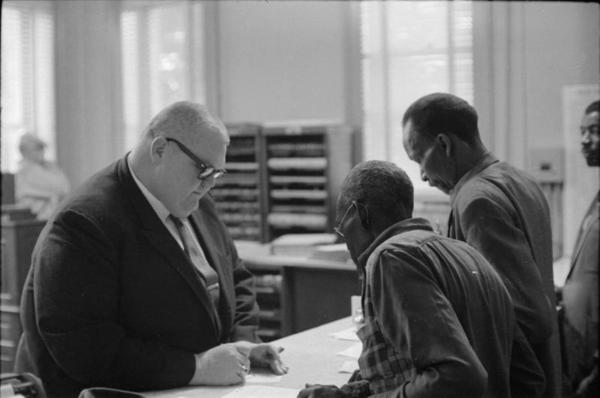 Circuit Clerk Theron Lynd with voter registration applicants in Hattiesburg, Mississippi, January 22, 1964, Moncrief Photograph Collection, MDAH