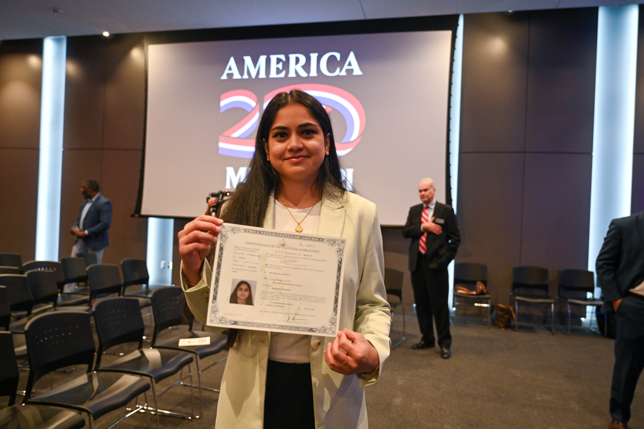 Kosada with certificate of citizenship