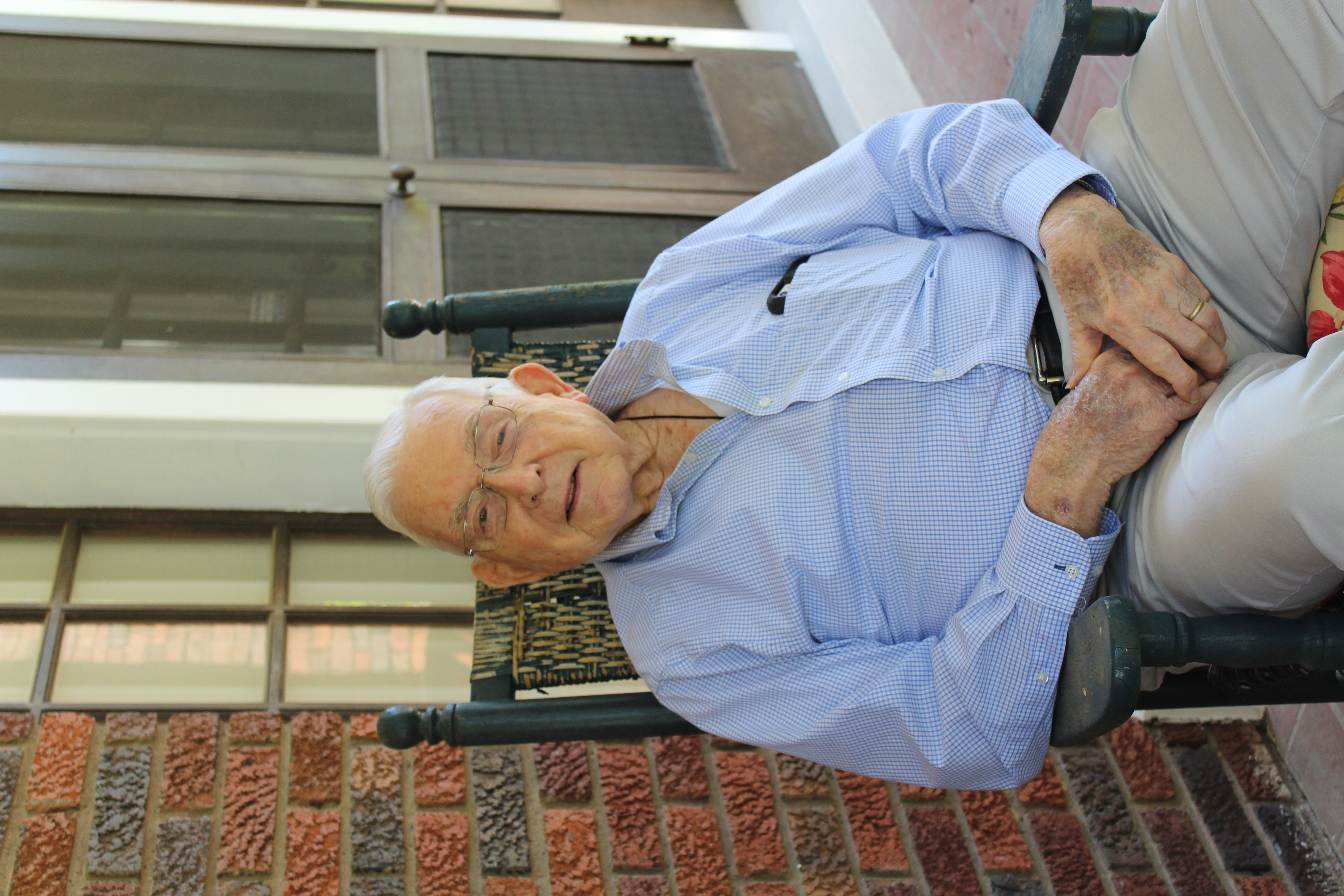 Al sitting in a chair.