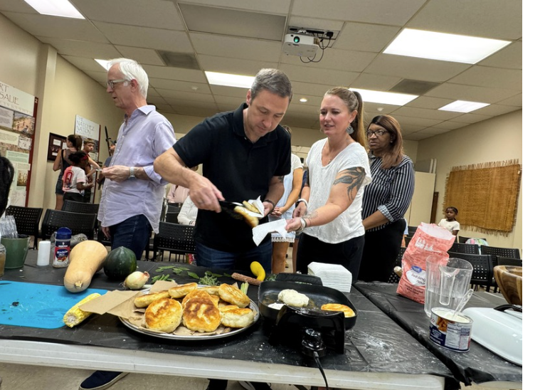 Visitors grab food from the demonstration at GVNI