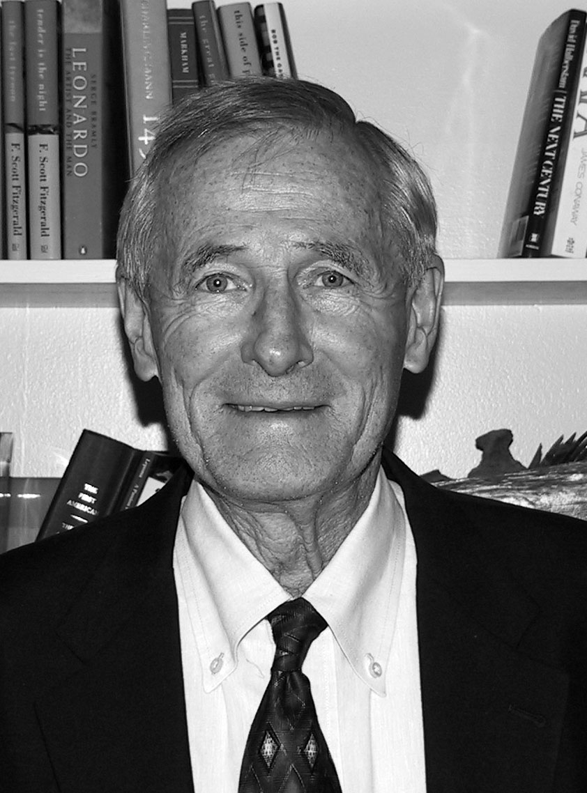 Black and white photo of Weeks smiling and looking into the camera. 